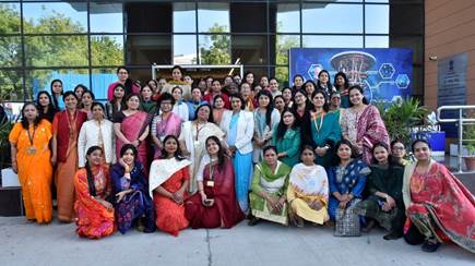 A group of women posing for a photoDescription automatically generated