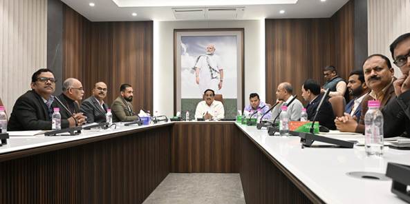 A group of people sitting in a meetingAI-generated content may be incorrect.