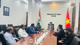 A group of people sitting around a tableDescription automatically generated