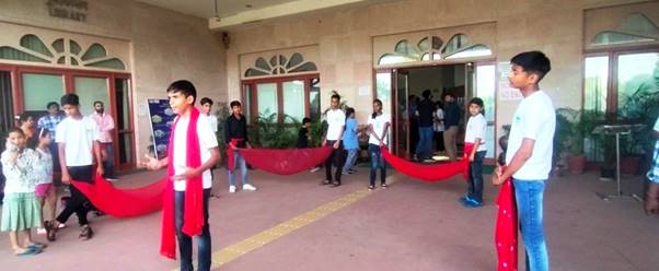 A group of people standing outside a buildingDescription automatically generated with low confidence