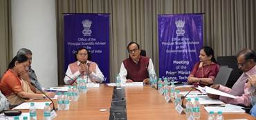 A group of people sitting at a tableAI-generated content may be incorrect.