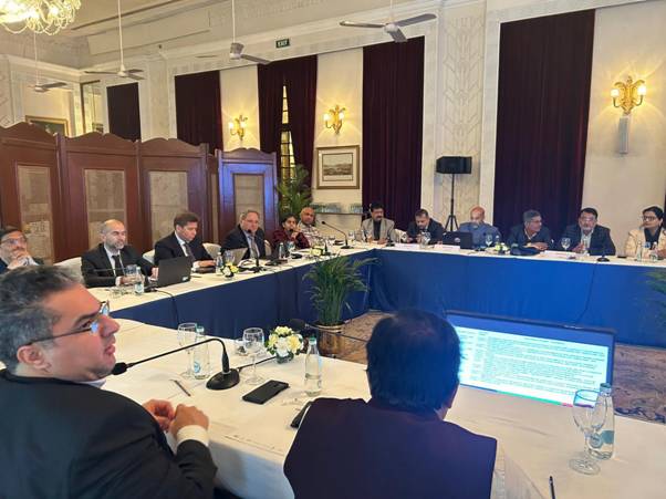 A group of people sitting at a tableDescription automatically generated