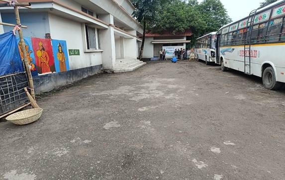 A group of buses parked in front of a buildingAI-generated content may be incorrect.