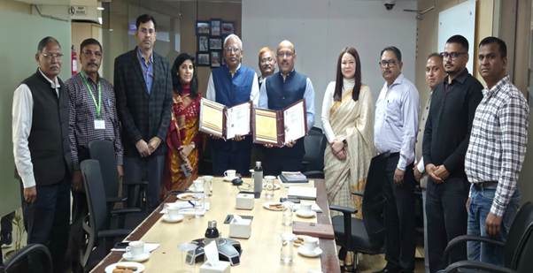 A group of people standing around a tableAI-generated content may be incorrect.