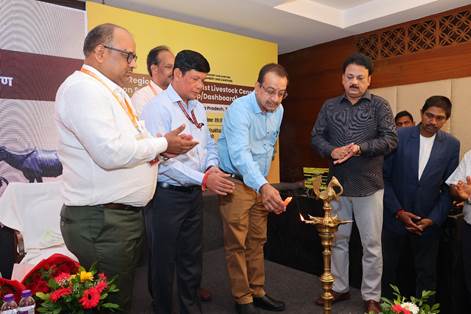 A group of men standing around a gold objectDescription automatically generated