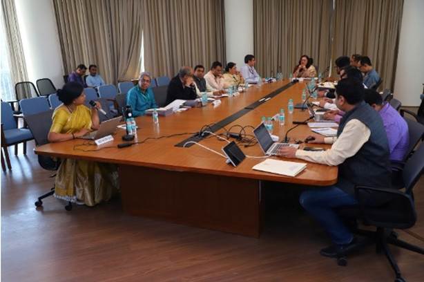 A group of people sitting at a tableAI-generated content may be incorrect.