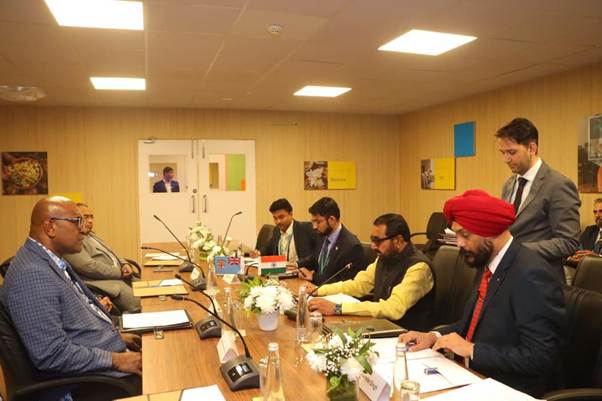 A group of people sitting around a tableAI-generated content may be incorrect.