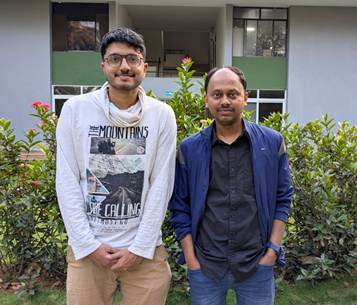 Two men standing in front of a buildingAI-generated content may be incorrect.