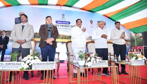 A group of people standing on a stageAI-generated content may be incorrect.