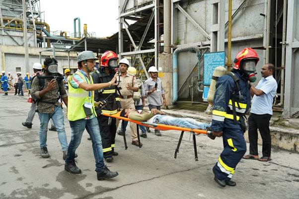 rescue team members shifting a perosn as part of the mock drill at visakhapatnam steel plant.jpg