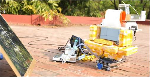 A machine on a brick surfaceDescription automatically generated