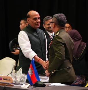 A person shaking hands with another personDescription automatically generated