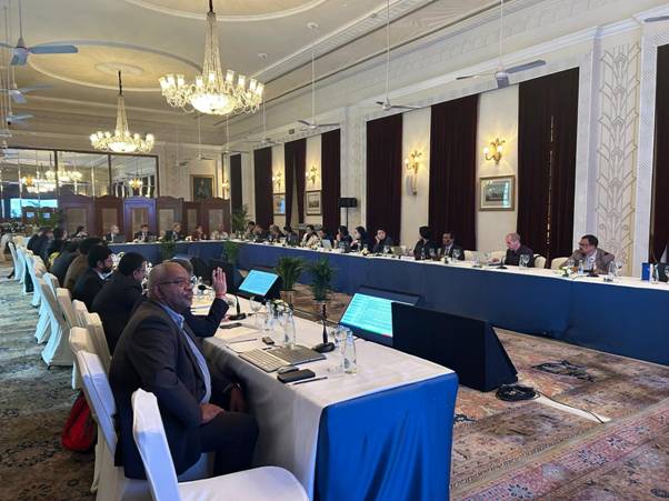 A group of people sitting at a tableDescription automatically generated