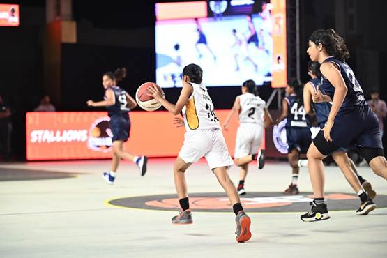A group of people playing basketballAI-generated content may be incorrect.