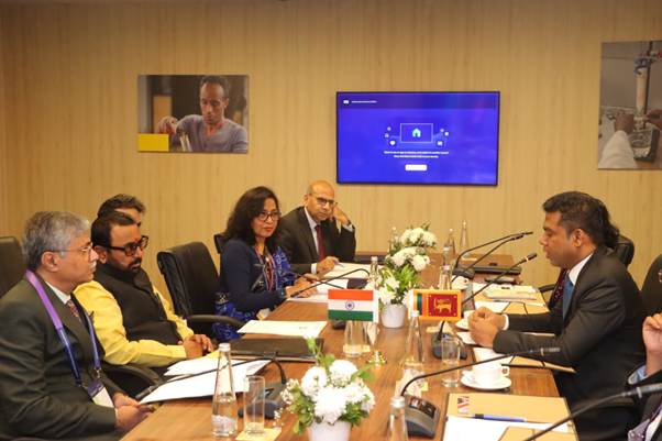 A group of people sitting at a tableAI-generated content may be incorrect.