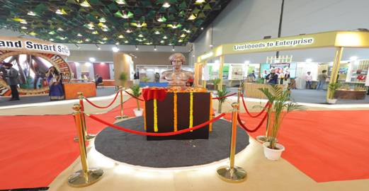 A red carpet with rope around a statueAI-generated content may be incorrect.