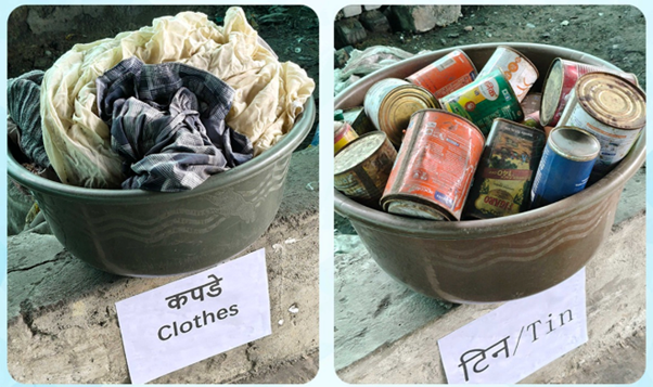 A group of containers with clothes and cansDescription automatically generated