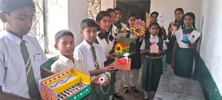 A group of children holding a boxDescription automatically generated