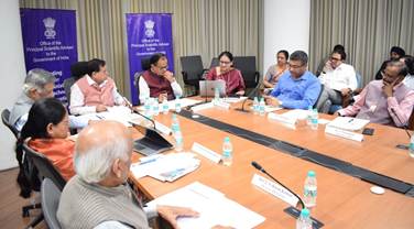 A group of people sitting around a tableAI-generated content may be incorrect.