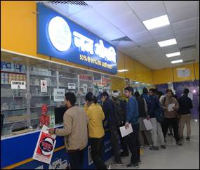 A group of people standing in a lineDescription automatically generated