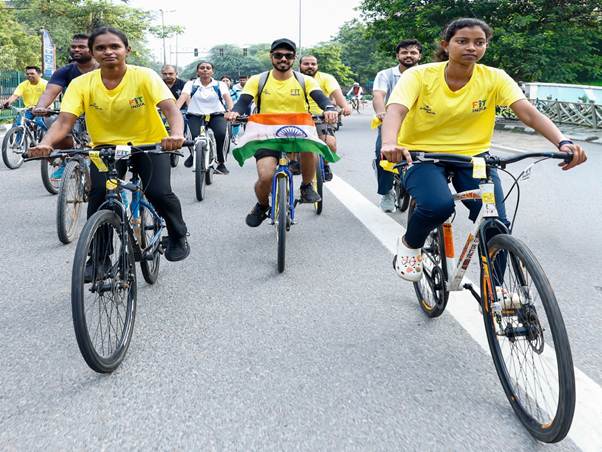 A group of people riding bicyclesDescription automatically generated