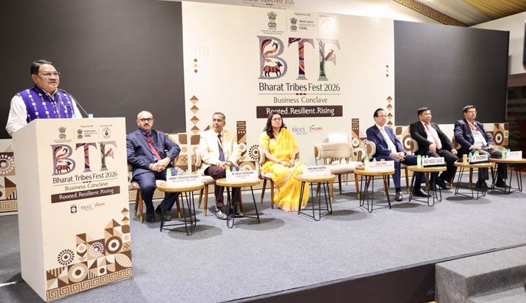 A group of people sitting on a stageAI-generated content may be incorrect.