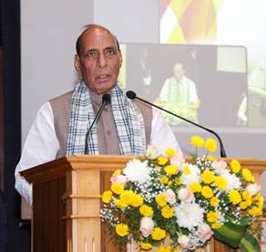 A person standing at a podium with a microphoneDescription automatically generated