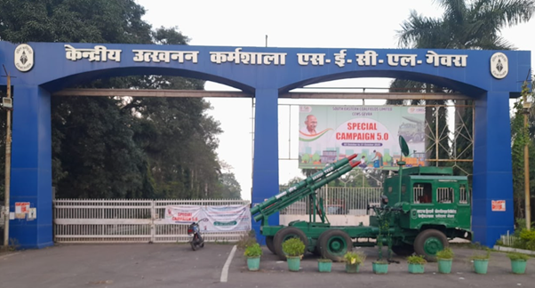 A large blue arch with a green vehicle and a motorcycleDescription automatically generated with medium confidence