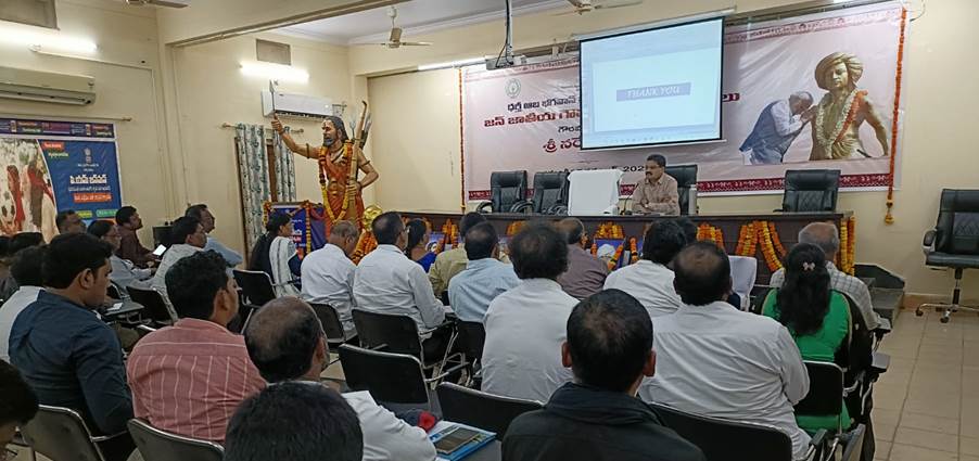 A group of people sitting in chairs in front of a screenAI-generated content may be incorrect.