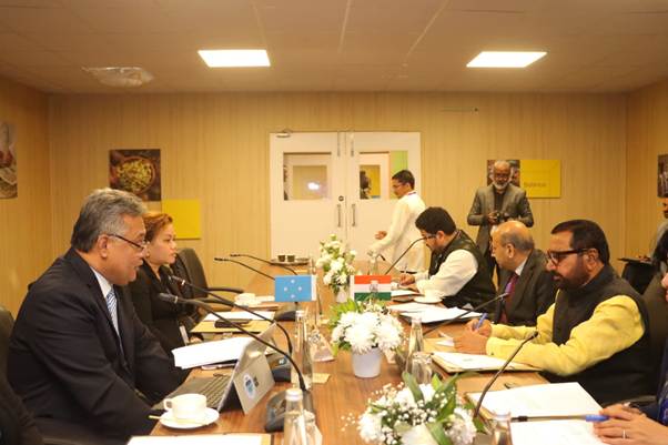 A group of people sitting at a tableAI-generated content may be incorrect.