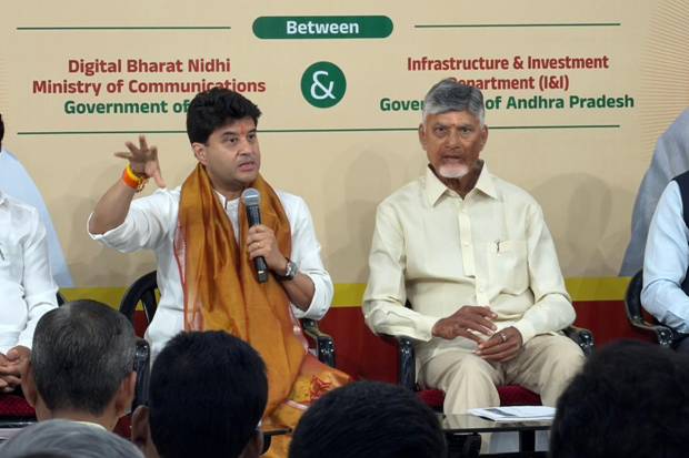 A person speaking into a microphoneDescription automatically generated