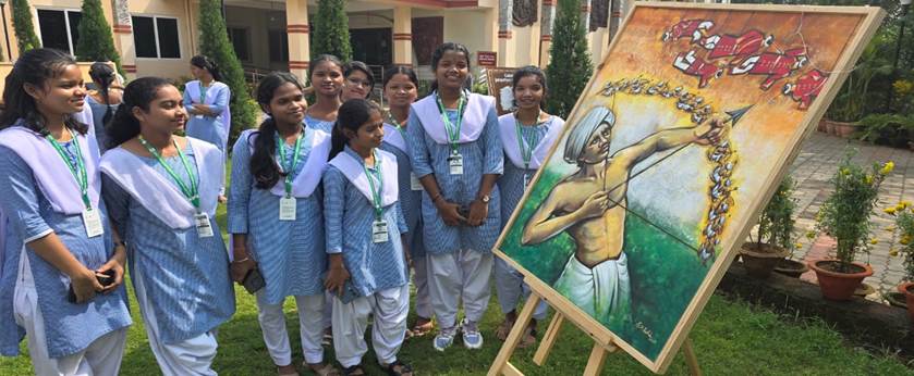 A group of girls standing next to a paintingAI-generated content may be incorrect.