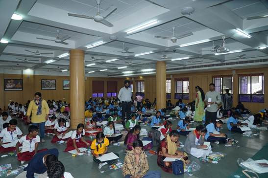 A group of children sitting on the floorAI-generated content may be incorrect.