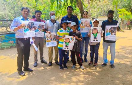 A group of people holding up postersDescription automatically generated