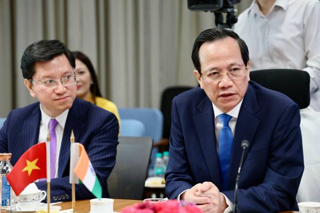 A group of men sitting at a tableAI-generated content may be incorrect.