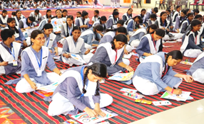 A group of students sitting on the floorAI-generated content may be incorrect.