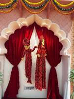 A group of puppets in red dressesAI-generated content may be incorrect.