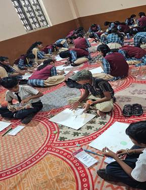 A group of people sitting on the floorAI-generated content may be incorrect.