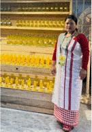 A person standing in front of a shelf of bottlesAI-generated content may be incorrect.