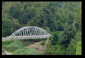 A bridge over a riverDescription automatically generated with medium confidence