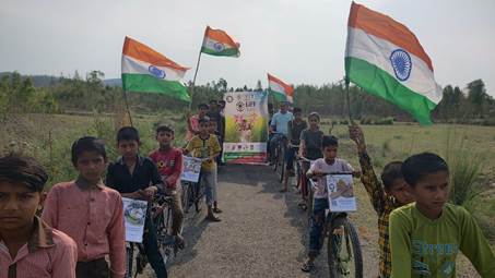 A group of people on bicycles holding flagsDescription automatically generated with medium confidence