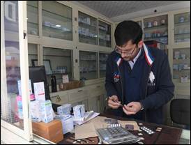 A person in a pharmacyDescription automatically generated