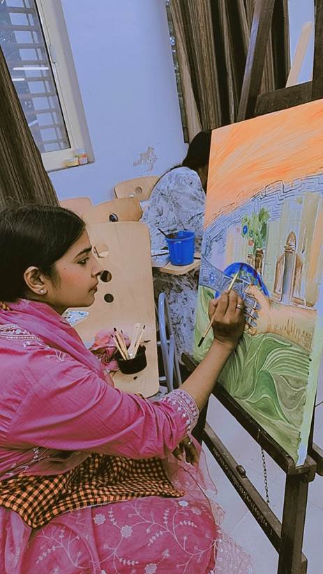 A person painting on a canvasAI-generated content may be incorrect.