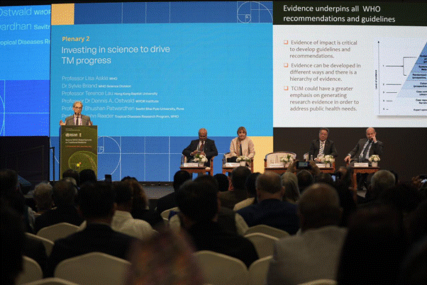 A group of people sitting at podiums in front of a large screenAI-generated content may be incorrect.