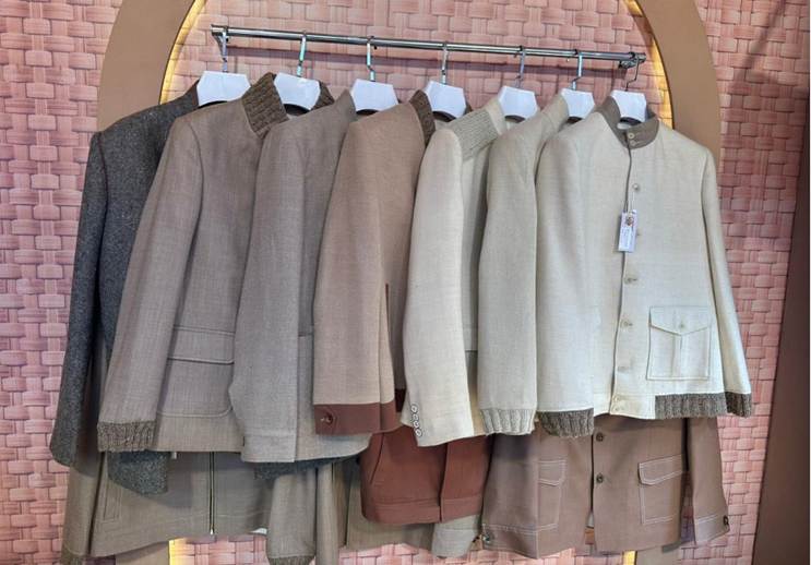 A group of jackets on a rackAI-generated content may be incorrect.