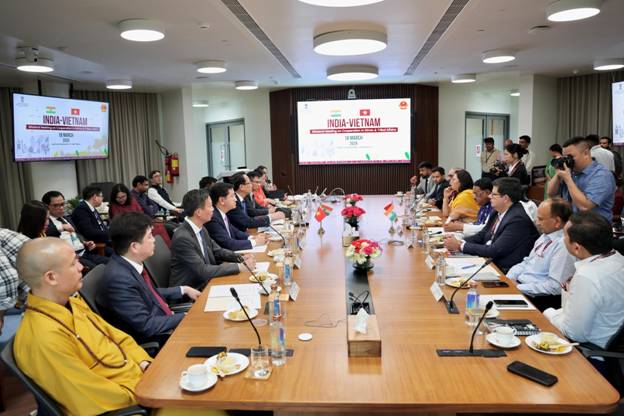 A group of people sitting at a tableAI-generated content may be incorrect.