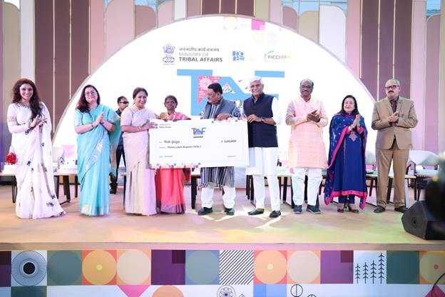 A group of people on a stageAI-generated content may be incorrect.