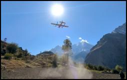 A plane flying over a mountainAI-generated content may be incorrect.