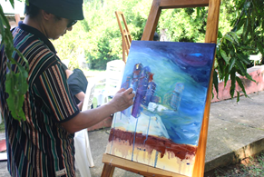 A person painting a pictureAI-generated content may be incorrect.