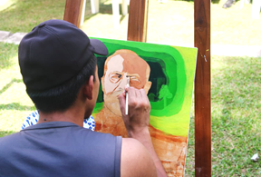 A person painting a pictureAI-generated content may be incorrect.